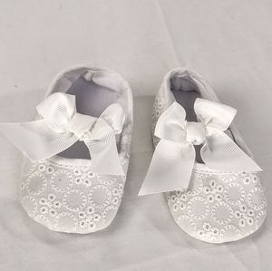 NWOT white eyelet baby booties flawed